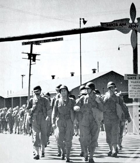 Soldiers of the 414th Air Base Squadron Depart Through Santa Ana Army Air Base's Gate 3 on a Five-Mile Hike to an Undisclosed Bivouac Site.