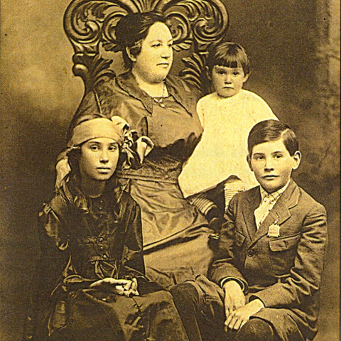 19th century photo portrait of mother with three kids
